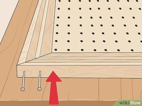 How to Frame Pegboard (with Pictures) - wikiHow Hang Pegboard, Peg Board Walls, Peg Wall, Pegboard Display, Pegboard Storage, How To Make Frames, Room Storage Diy, Pegboard Organization, Craft Shed