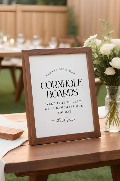 Make your special day even more memorable with our charming "Sign Our Cornhole Boards" wedding sign! A unique twist on the traditional guestbook, this sign invites your guests to leave their well-wishes and signatures on your cornhole boards. Perfect for outdoor and rustic weddings, it's a fun and personal keepsake you'll cherish for years to come. Non-editable, just print and party! Diy Wedding Cornhole Boards, Non Traditional Guest Book Ideas, Sign Our Cornhole Boards, Wedding Cornhole Boards Guest Books, Corn Hole Guest Book, Cornhole Guest Book, Cornhole Boards Wedding, Wedding Cornhole Boards, Wedding Cornhole