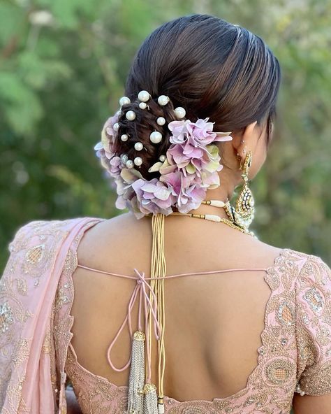 Give a modern twist to your updo with twisted bridal bun accessorised with pearls & dual toned hydrangeas.❤ Makeup : @dollyouup_bys Bride : @aalisha_95 Hair : Team @dollyouup_bys Event : @kkingsevents #pearls #bride #assamesebride #makeup #hairstyle #bridalbun #twistedhairbun #hairaccessories #bridalhairaccessories #wishnwed #sabyasachibride #bridesofindia #bridesofinstagram #bridaldiaries #hairstyles #hairgoals #hairoftheday #hairofinstagram #redcockscomb #weddingday #indianwedding #ramb Hair Twist Bun, Buns Hairstyles, Hydrangeas Flowers, Butterfly Hairstyle, Event Hairstyles, Bridal Hairstyle Indian Wedding, Hair Style On Saree, Long Bridal Hair, Hair Style Vedio