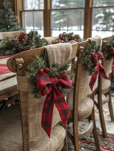 27 Farmhouse Christmas Dining Table Decor Ideas You’ll Love Dining Room Chair Christmas Decoration, Chair Bows Christmas, Chair Christmas Decorations, Farmhouse Christmas Dining Table Decor, Farmhouse Christmas Dining Table, Christmas Chair Decorations, Christmas Dining Table Decor Ideas, Dining Table Decor Ideas, Christmas Dining Table Decor