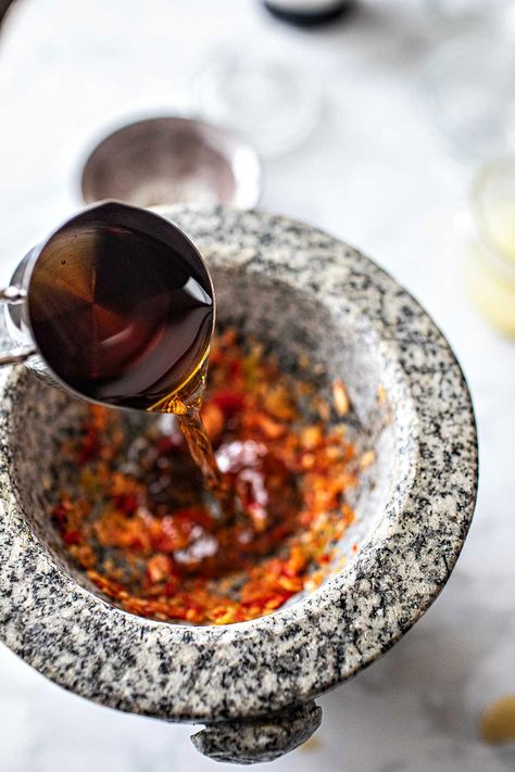 Jeow Som (Lao spicy dipping sauce) is a delectable sauce known for its spicy, tangy, and umami-rich flavors. Enjoy the authentic flavors of Lao cuisine with this simple and beloved staple that pairs well with many dishes using simple ingredients. Quick and easy to serve in 10 minutes! #jeowsom #laodippingsauce #laospicydippingsauce #laofood #laosauces #laorecipes #isaanfood #thaisauces #thaisauce Jeow Som, Thai Chili Pepper, Gluten Free Fish, Spicy Dipping Sauce, Laos Food, Thai Sauce, Healthy Substitutions, Papaya Salad, Small Food Processor