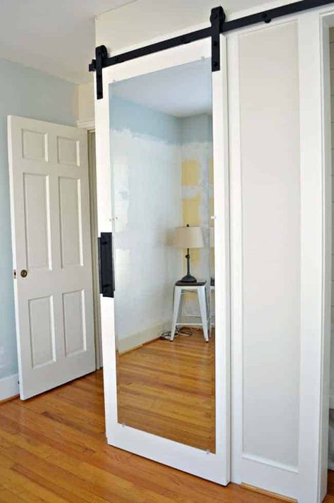 How to make a DIY mirrored barn door, out of an old door, for a guest bedroom closet. Mirrored Barn Door, Diy Barn Door Cheap, Barn Door Diy, Mirrored Bedroom, Mirror Repurpose, Cheap Barn Doors, Mirror Barn Door, Bedroom Barn Door, Diy Closet Doors