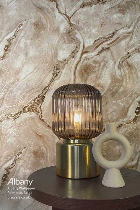 Introducing the stunning Albany Palmetto wallpaper from the Albany Verona Collection. This exquisite pattern features hints of shimmer and metallic lines, capturing the natural beauty and intricate patterns of cut agate. Available in store at Brewers Decorator Centres or online at brewers.co.uk. Follow the link to take a closer look and add it to your basket today 🛒 Agate Wallpaper, Taupe Wallpaper, Albany Wallpaper, Statement Wallpaper, Charcoal Wallpaper, Look Wallpaper, Liquid Marble, Cream Wallpaper, Marble Wallpaper