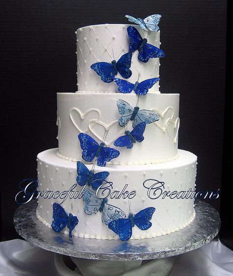 Elegant White Wedding Cake with Butterflies and Hearts Wedding Cake With Butterflies, Elegant White Wedding Cake, Cake With Butterflies, Royal Blue Wedding Cakes, Royal Blue Cake, Butterfly Wedding Cake, Quince Cakes, Quince Cake, Elegant White Wedding