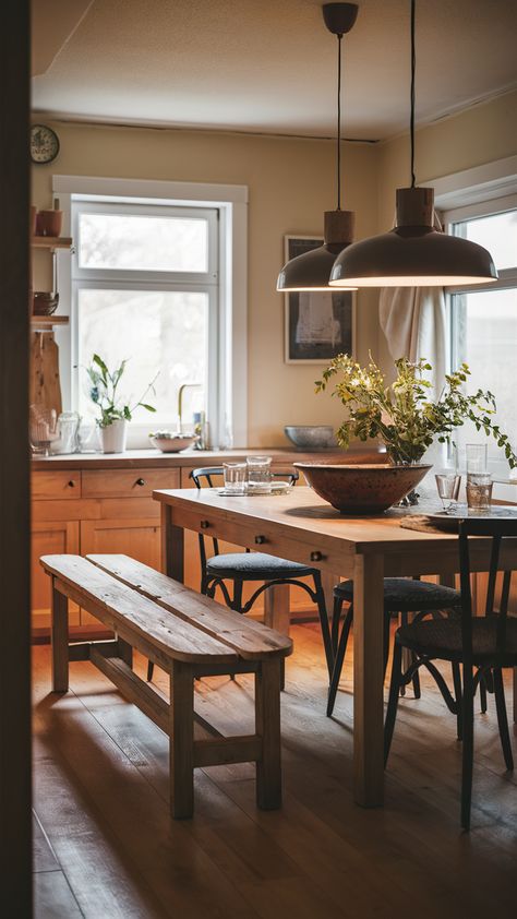 Elevate your dining experience with this charming rustic kitchen bench styled in true IKEA fashion! This inviting space features an extendable BJURSTA table paired with classic INGOLF chairs, perfect for family gatherings or intimate dinners. The decorative STOCKHOLM bowl adds a touch of personality, while the warm glow from the KNIXHULT pendant lamp creates a convivial atmosphere. Discover how to create your own homey dining area that welcomes everyone. Click to explore more styling tips! #IKEAStyle #DiningRoomInspo #HomeDecor Dinner Table With Bench, Ingolf Chair, Ikea Rustic, Bjursta Table, Cozy Dining Area, Ikea Bench, Kitchen Bench, Rustic Chair, Warm Lighting