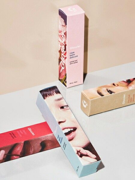 Glossier Balm dotcom Flavored Quirky Packaging, Glossier Packaging, Packaging Creative, Glossier Balm Dotcom, Lipstick Designs, Cosmetic Packaging Design, Makeup Package, Skincare Packaging, Cool Packaging