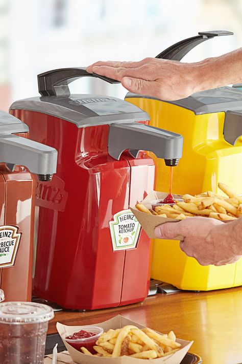 Person using condiment dispenser to put ketchup in container with french fries. Wall Mounted Pc, Food Cart Business, Condiment Dispensers, Kitchen Materials, Condiment Dispenser, Decor Inspiration Diy, Profitable Crafts, Food Dispensers, Heinz Ketchup