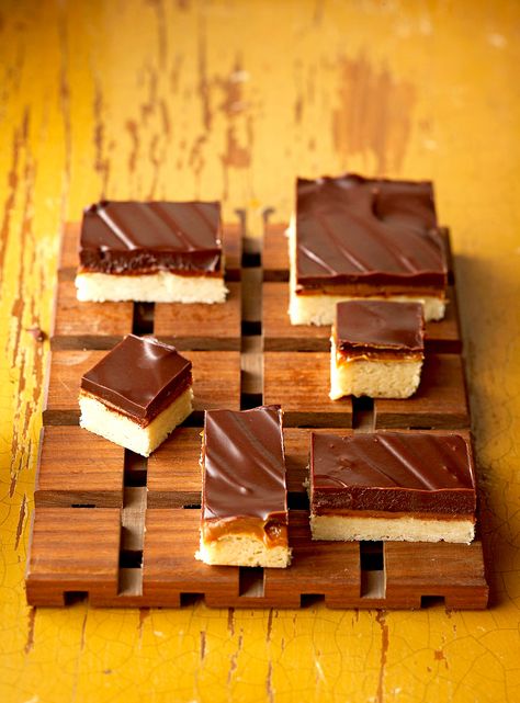 It's a good thing these dessert bars are freezer friendly (you might eat them all at once otherwise). #freezermeals #mealprep #makeahead #easyfreezerrecipes #bhg Homemade Candy Bars, Millionaire Shortbread, Shortbread Bars, Layered Desserts, Chocolate And Peanut Butter, Homemade Caramel, Homemade Candies, Bar Cookies, Cookies Brownies