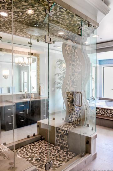 The master bathroom's free-standing shower stall is open on both sides and has a river of tile flowing down the center. Traditional Mansion, Primary Bathroom Design, Bathroom Shower Stalls, Unique Bathroom Design, Shower Stalls, Gorgeous Homes, Luxury Master Bathrooms, Tub Ideas, River Rocks