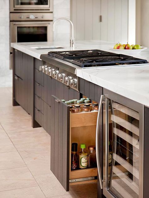 Utilize pullout shelves and cabinets to increase visibility. Pullouts work well for storing smaller items, such as jars of spices or bottles of vinegars and oils, so they are less likely to get lost in the recesses of a cavernous cabinet. Kitchen Island Storage Ideas, Kitchen Island With Cooktop, Island With Stove, Kitchen Island With Stove, Kitchen Island Storage, Island Storage, Kitchen Island With Sink, Kitchen Island With Seating, Kitchen Storage Solutions