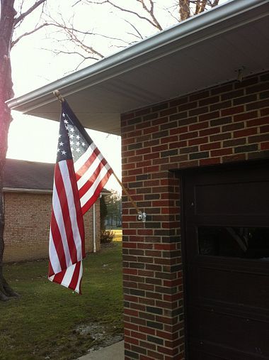 Old glory isn't going anywhere now!  Good info on how to hang a flag on brick.. Flag On House Exterior, Hanging Flag On House, Flag Pole On House, Flag Pole Ideas Diy, American Flag On House, Flag On House, Flag Display Ideas, Brick Porch, Eagle Project