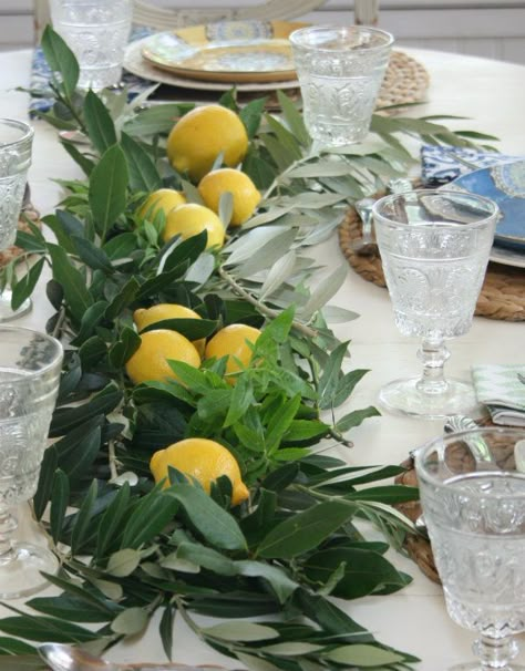 Layer fresh herbs down the center of the table  and finish off with a few lemons placed on top of the  fragrant herbs. Italian Style Table Decor, Italian Theme Party Decorations Centerpiece Ideas, Appertivo Party, Italian Inspired Table Setting, Italian Table Decorations Dinner Parties, Italian Aesthetic Party, Italian Dinner Party Table Settings, Italian Birthday Party Ideas Decorations, Italian Anniversary Party Ideas