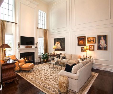 Tall, Two-Story windows with thick trim and wainscoting outlines. Tall Wall Trim, Two Story Wainscoting Family Rooms, Family Room Trim Ideas, Two Story Living Room Wall Moldings, Molding On Tall Walls, Wainscoting Tall Walls, Wainscoting Family Room, Two Story Wainscoting, Tall Wainscoting Ideas