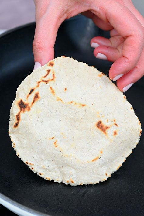 A hand holding a homemade corn tortilla Corn Tortilla Casserole, Corn Tortilla Recipe, Corn Flour Tortillas, Bulk Recipes, Corn Tortilla Recipes, Bibimbap Recipe, Carb Friendly Recipes, Blue Corn Tortillas, Healthy Dark Chocolate