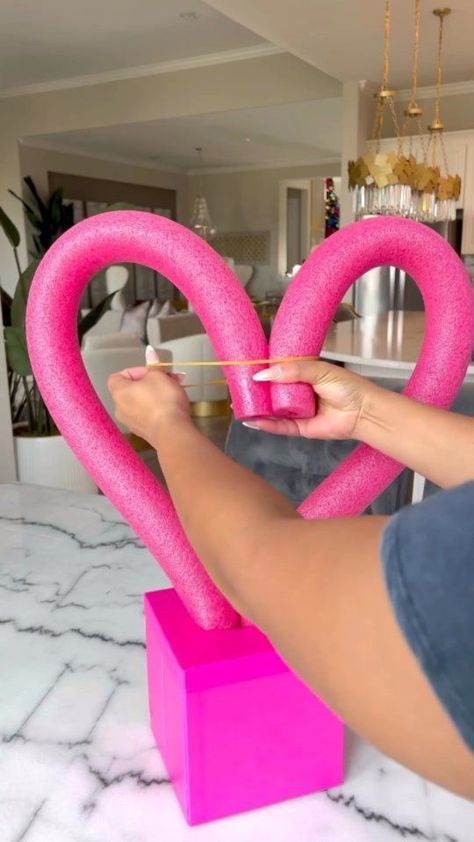 Cute DIY Valentine’s Centerpiece❤️ ⠀ 🎥 @tamarabradshaw_home Pool Noodle/Pink Roses/Love Sign/Skewer Sticks/Bows: Dollar Tree✨ Pink Box/Red Roses: Will link in my stories✨ ⠀⠀⠀⠀ Use rubber bands and Skewers to anchor. So simple to make!!! Inspired by @lou_flores❤️ ⠀⠀⠀⠀⠀ #diy #diyhomedecor #diyprojects #diyproject #diydecor #diyideas #valentines #mrsgdiydesigns | KaTrina Robinson-Gorham | Camerda-G · Lit Valentines Outdoor Decorations, Lemon Wreaths, Valentines Window Display, Valentines Day Baskets, Valentine Centerpieces, Valentine Baskets, Diy Valentine's Day Decorations, Valentine Craft, Valentine Tree