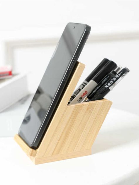 the bamboo angled desk pen holder with phone stand, an eco-friendly and stylish solution for your office organization needs. Crafted from high-quality bamboo, this pen holder features a unique angled design that provides easy access to your pens, pencils, and other office supplies. Additionally, it includes a convenient phone stand, keeping your device within reach while you work. Material:bambooSize:8cm(L)*12cm(H) (1 inch=2.54cm) Angled Desk, Desk Pen Holder, Wood Pen Holder, Wood Phone Stand, Rustic Wood Crafts, Phone Stand For Desk, Bamboo Pen, Scandinavian Furniture Design, Office Organizer