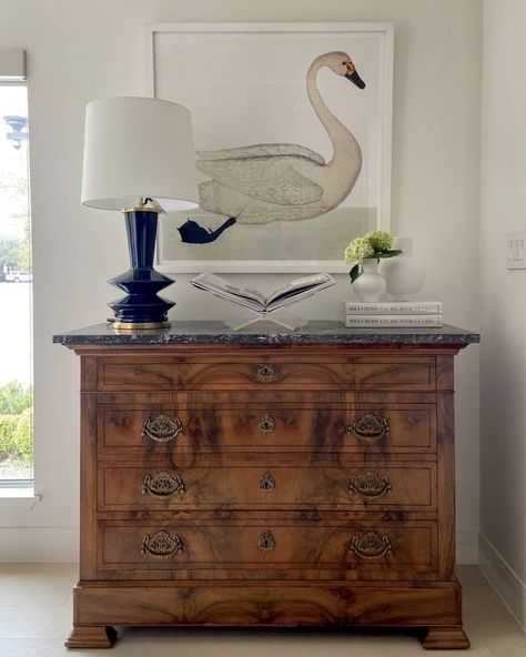 Paloma & Co on Instagram: “Paloma & Co Classics ✨ This beautiful vignette featuring a stunning Burled Walnut French Louis Philippe Commode paired with a modern lamp…” Swan Print, Louis Philippe, Modern Lamp, Old World Charm, Dresser As Nightstand, Antique Dresser, Paloma, Old World, Walnut