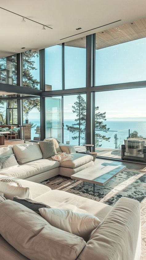 Luxurious oceanfront living room with panoramic sea views, elegant furnishings, and modern decor Furnished Living Room, Beach House Flooring, Dream Life House, Modern Beach House, Coastal Home, Floor To Ceiling Windows, Neutral Colour Palette, Coastal Homes, Neutral Color