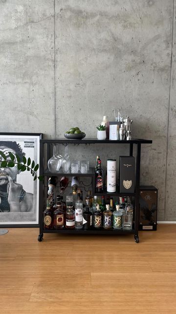 John Baptist on Instagram: "A good looking living space deserves a great bar cart! It’s been almost 1 year since I purchased this cart and honestly, I’m glad I did! • • • • • • #apartmenttherapy #homedecor #barcart #barcartstyling #apartmentdecor" Men’s Bar Cart, Apartment Bar Cart, Aesthetic Bar Cart, John Baptist, Apartment Bar, Bar Cart Styling, Apartment Therapy, Cigars, Bar Cart