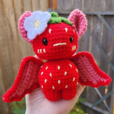 🦇🍓STRAWBERRY BAT🍓🦇 If you want to keep a bit of summer with you year-round, this friend's got you covered! I let the creative juices flow with this one, and I'm so happy with how it turned out! 🥹 🗒Pattern: Base pattern by @crochet.me.zaddy with modifications by me 🧶: @michaelsstores Loops & Threads Soft Classic and @joann_stores Big Twist Value . . . #crochet #handmade #crochetersofinstagram #crochetaddict #amigurumi #crochetlove #crocheting #yarn #instacrochet #handmadewithlove  #crocheti... Strawberry Shortcake Bat Dragon, Crochet Strawberry Shortcake, Red Amigurumi, Crochet Worm, Crochet Stuffys, Bat Dragon, Bat Crochet, Crochet Bat, Big Twist