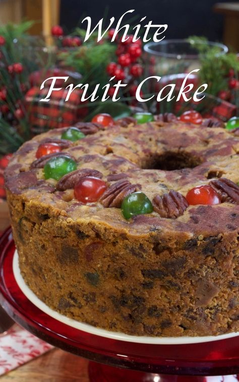 This homemade White Fruitcake puts store-bought fruitcakes to shame.  It's packed full of fresh pecans, raisins and candied fruit and get cured under a wine-soaked cheesecloth for four weeks.  It's well worth the wait too. A great Christmas family tradition!! #fruitcake #homemadefruitcake #whitefruitcake #christmasfruitcake #christmascakes #holidaycakes #fruitcake #mycountrytable White Fruit Cake Recipe Old Fashion, Christmas Fruit Cake Recipe, Candied Cherries, Fruit Cake Recipe Christmas, Christmas Fruit Cake, Tube Cake Pan, Fruit Cake Recipe, Candied Pineapple, Cake Light