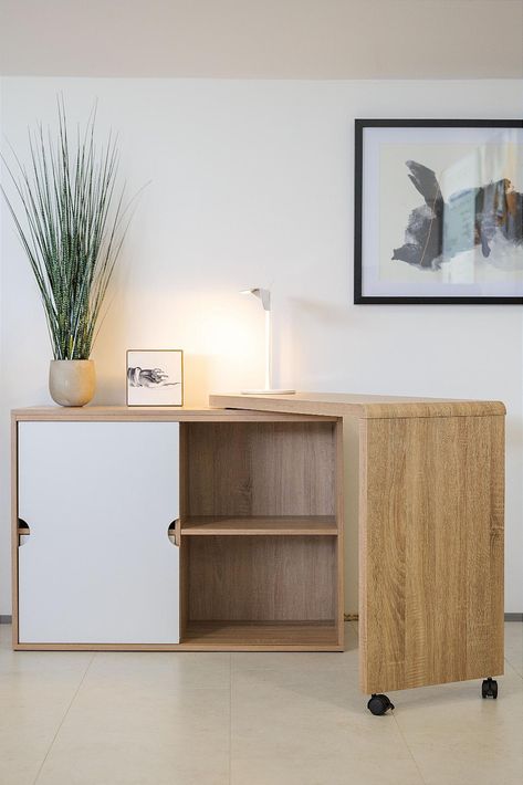 Home office desk in Sonoma Oak effect finish and white accents Spacious work area Folds away when not in use Desk can be assembled to have a left or right hand return Two storage drawers Sliding door concealing additional storage area This clever desk design allows you to utilise small spaces in your home by opening up to a large corner desk and neatly folding away when youve finished working. The sliding door helps to hide away any office mess and leaves the desk looking like a tidy sideboard when not in use. This desk can be ordered for self assembly flatpack price or assembled by our delivery team see pre assembled price. For more information or to view the product for yourself, please visit us in Ash Vale. Discreet Desk In Living Room, Slide Out Desk Work Surface, Moveable Desk, Sideboard Desk, Sliding Desk, Folding Office Desk, Large Corner Desk, Console Table Lamp, Flex Space