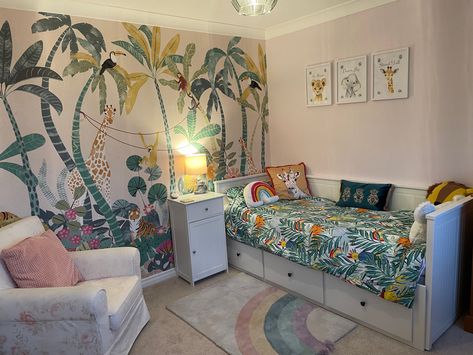 Jungle themed with rainbows. Dunelm mural wallerpaper Dunelm Mural, Dunelm Jungle Mural, Girls Jungle Bedroom, Jungle Bedroom Kids, Minnie Bedroom, Jungle Bedroom Theme, Jungle Theme Rooms, Jungle Themed Bedroom, Jungle Bedroom