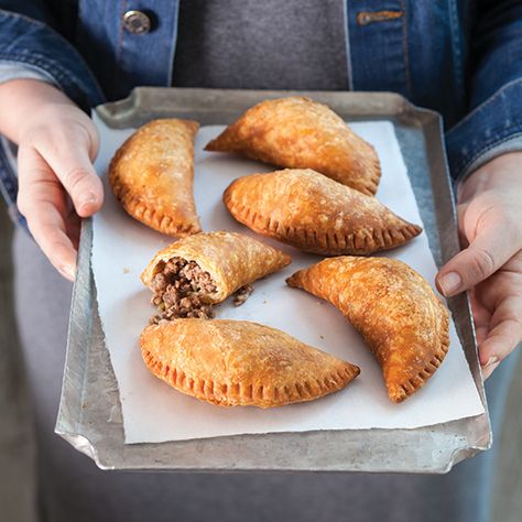 The Natchitoches meat pie, filled with a savory mixture of beef, pork, and the Cajun trinity, is one of Louisiana’s most beloved snacks. See more authentic hand pie recipes instantly by downloading our September/October digital issue. Pasteles Recipe, Cajun Trinity, Empanada Recipes, Meat Entrees, Pie Ideas, Meat Pie Recipe, Hand Pie Recipes, Hand Pie, Meat Pies