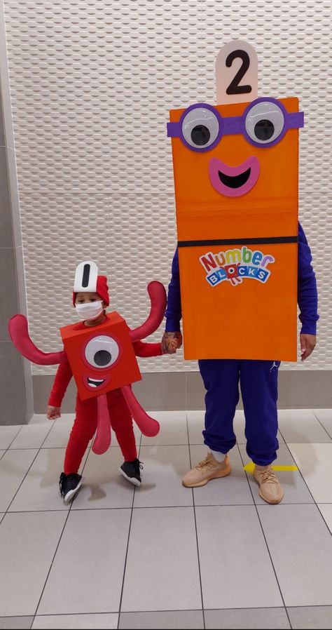 Numberblocks costumes i made for me and my son this year. Number Day Costume Ideas, Number Block Party, Number Blocks Birthday Party, Numberblocks Birthday, Math Day, Block Birthday Party, Block Pumpkins, Me And My Son, Number Blocks