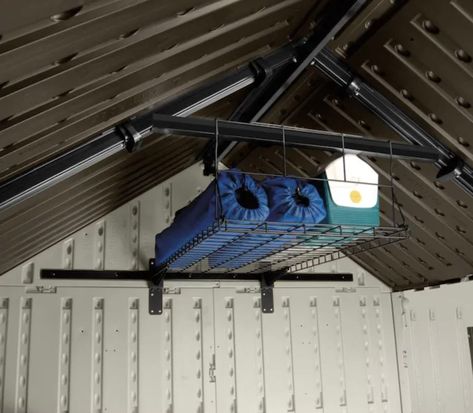 11 unfinished attic storage ideas and tips to organize your space | Real Homes Loft Shelf, Shed Shelving, Shed With Loft, Steel Storage Sheds, Overhead Garage Storage, Overhead Garage, Shed Organization, Loft Storage, Ceiling Storage