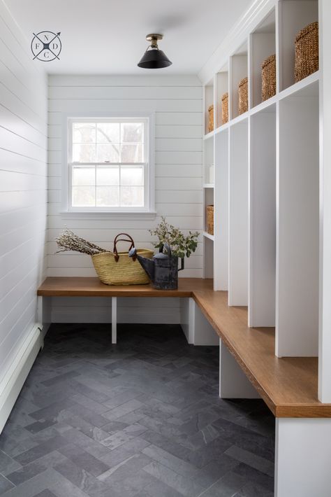 North Fork Design Co.  #chestnutstproject Traditional | Functional | Mudroom | White shiplap | Caubby storage | Woven baskets | Wood bench seating | Grey herringbone floor tile | Classic | Black ceiling mount light fixture Herringbone Tile Floors, Laundry Room Tile, Mudroom Remodel, Mudroom Flooring, Mudroom Decor, Mudroom Laundry Room, Mudroom Ideas, Mudroom Design, Mudroom Laundry