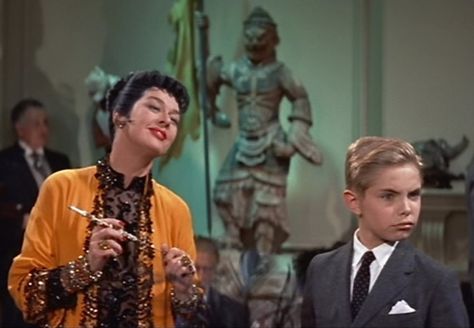 Rosalind Russell and Jan Handzlik as Auntie Mame and her little love, Patrick. Orry Kelly, Auntie Mame, Phoenix Fire, Rosalind Russell, Requiem For A Dream, Favorite Christmas Songs, Movie Fashion, Family Movies, Film Books