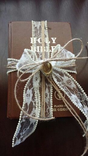 Using this in place of a traditional ring bearer pillow. Inexpensive alternative if you have a favorite book or bible at home. Ring Bearer Pillow Alternative Unique, Ring Bearer Bible, Bible Ring Bearer, Ring Bearer Carrying Ideas, Diy Ring Bearer Pillow, Ring Bearer Alternative Ideas, Wedding Ring Pillow Alternative, Ring Bearer Ideas, Ring Bearer Pillow Alternative