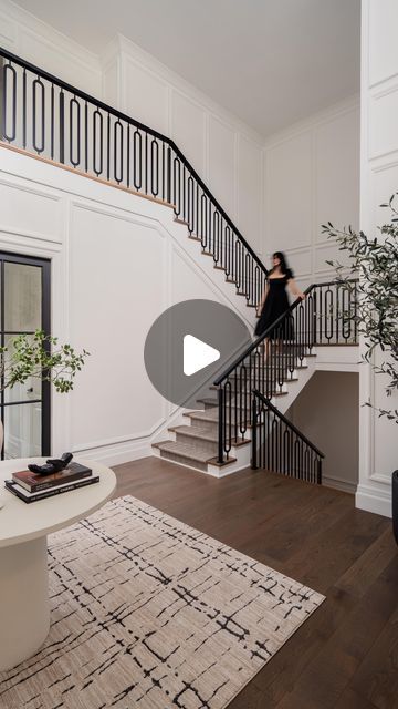 LUX decor on Instagram: "The stairwell at our Glenmore Project is another moment—a perfect blend of impact and elegance that so many of you have asked about. The metal detailing on the spindles adds a touch of modern sophistication while keeping the design timeless. It’s a space that feels grand yet understated, with every detail thought through for a busy, high-traffic home. The runner we chose is both stylish and practical, standing up beautifully to the hustle and bustle of a big family while still maintaining that luxurious feel underfoot. It’s another example of how functionality and beauty can coexist, and why this stairwell continues to be a fan-favourite. 

Design by LUX decor
Architecture by Rhona Goldenberg" Dual Staircase Entryway, Dual Staircase, Stairs Railing Design, Transitional Staircase, Foyer Stairs, Lux Decor, Metal Handrails, 2 Story Foyer, Stair Railing Design