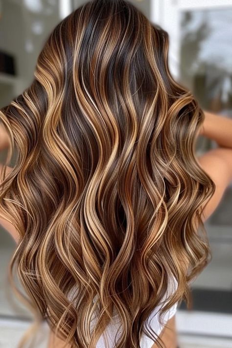 Wavy hair in rich brown with blonde highlights cascading down the back. Hair Color Ideas For Golden Brown, Face Framing Layers And Highlights, Caramel Blonde Brown Hair, Carmel And Blonde Highlights Brown Hair, Caramel Highlights Wavy Hair, Highlights Brown Hair Blonde Honey Caramel, Coffee Highlights Hair, Caramel Ombre Hair Honey, Medium Length Brown Hair With Highlights Caramel