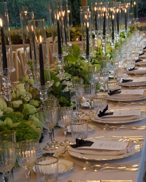 An elegant tablescape featuring tall black candles, lush greenery, and gold-rimmed glassware, creating a sophisticated dining experience. Perfect for a luxurious evening event! #eventigaia #weddingreception #weddingplanner #destinationwedding #ElegantDinner #TablescapeGoals #miseenplace #tablesetup Private Dinner Party Decor, Private Dinner Party, Elegant Dinner, Table Set Up, Black Candles, Lush Greenery, Dining Experience, Dining Experiences, Tablescapes