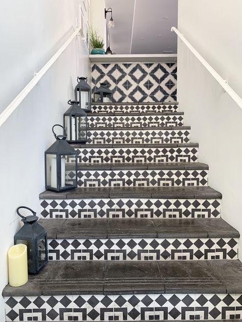 Black and white Moroccan tiles used as stair risers and black treads with lanterns make for a fun modern boho vibe. #stairs #blackandwhite #boho #moroccan #tiledstairs #tile #staircase Tile Staircase, Stair Tiles, Stairs Tiles Design, White Moroccan Tile, Greece Homes, Tiled Staircase, Front Door Steps, Black Stairs, Tile Steps