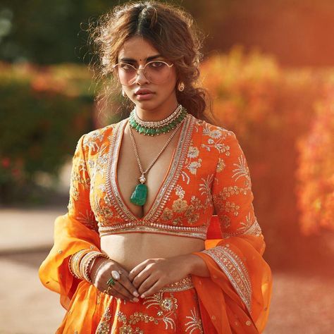 Stunning V neck Blouse design for brides | (C) Sabyasachi Mukherjee | Deep neck blouses | Orange Bridal Lehenga | Trending new blouse looks | Bride to be | Trousseau | Trending new blouse neck designs | Must have | #wittyvows #blouses #trousseau #trending #bridalwear #blousedesignideas #stunning #beautiful #deepneck #designs #orange #golden #embroidery Arabic Inspired Fashion, Pakistani Attire, Sabyasachi Collection, Khatli Work, Raw Silk Lehenga, Sabyasachi Lehenga, Saree Bollywood, Diesel Punk, Blouse Back Neck Designs