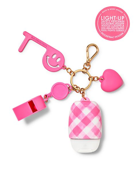 What it does: keeps your favorite sanitizer close at hand. Why you'll love it: Includes a light-up heart charm, whistle and door opener/button presser Convenient gold-tone clip attaches to your backpack, purse... Collab Ideas, Bow Wallpaper Iphone, Keychain Multitool, Pocketbac Holder, Cool Keychains, Pink Keychain, Hand Sanitizer Holder, Handbag Essentials, Pink Girly Things