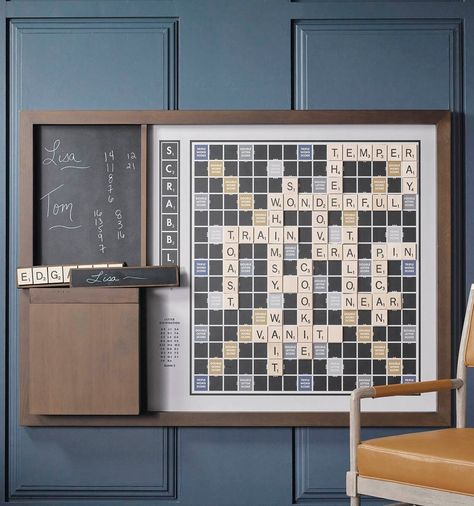 Perfect for casual, ongoing games, this oversized version of Scrabble hangs on the wall of your home or office and features custom graphics inspired by the original 1949 edition. Crafted with a solid wood frame and trim, this set includes 100 oversized magnetic tiles, four tile racks with chalkboard backs, chalk, eraser and solid wood storage box. Outdoor Foosball Table, Wall Scrabble, Wall Games, Game Table And Chairs, Scrabble Board, Wall Game, Scrabble Wall, Campus Design, Letter Tiles