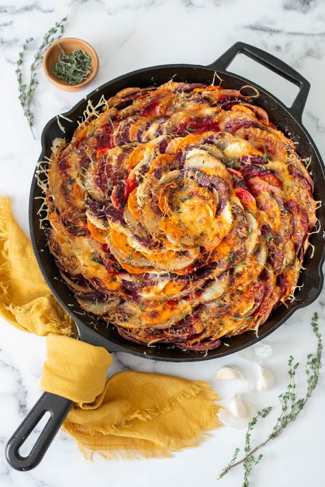 This cheesy root vegetable skillet is not only beautiful (look at those colors!) but also so delicious. It’s creamy, cheesy and loaded with soft and crispy veggies. It’s the perfect side dish for Thanksgiving. You can even bake it the night before and just heat in the oven the day of! Crispy Veggies, Side Dish For Thanksgiving, Vegetable Skillet, Root Vegetable, Purple Sweet Potatoes, Scalloped Potatoes, Shepherds Pie, Thanksgiving Side Dishes, Root Vegetables