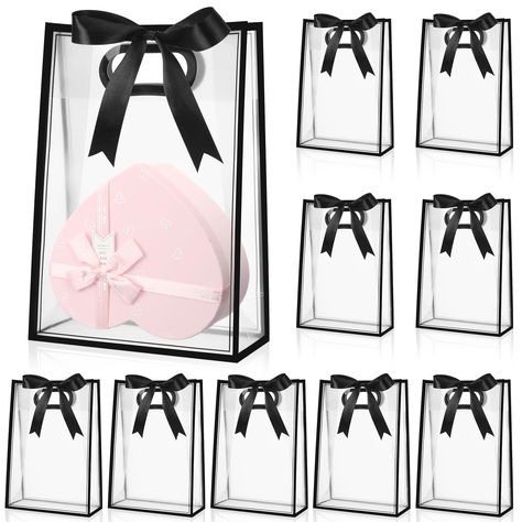 PRICES MAY VARY. Roomy Size and Quantity: with a clear gift bag size of about 7 x 10 x 3.15 inches/ 18 x 26 x 8 cm and a roll of 72 ft ribbon, the clear gift bags with ribbons provide ample space for your presents and nice decoration to wrap; The clear plastic gift bags package includes a set of 12 bags, which caters efficiently to your needs for large events or parties; The generous quantity and roomy size make it your ideal gift packaging solution Clear Design with an Elegant Border: the clear Graduation Gift Bags, Clear Gift Bags, Plastic Gift Bags, Party Favors For Adults, Birthday Goodie Bags, Retail Bags, Party Goodies, Birthday Gift Bags, Packaging Supplies