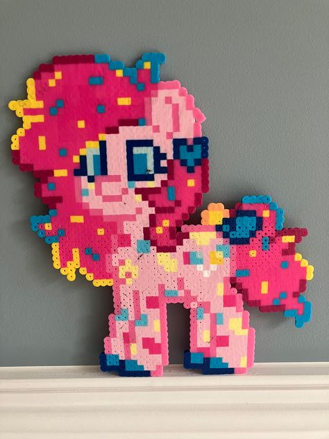 Some marks from the iron on the body, right eye, and hair. Ear is slightly misshapen. PONIES ARE CREATED IN PONYTOWN if anyone affiliated has an issue with this listing, please contact me Pinkie Pie Perler Bead Pattern, Tooth Perler Beads, Electric Guitar Perler Beads, Perler Bead Banana, Rainbow Dash Perler Bead Pattern, Spider Gwen Perler Beads, Mini Fuse Beads, Inside Out Perler Bead Patterns, Carebear Perler