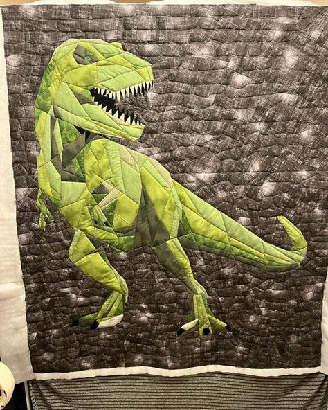 Becky on Instagram: "She decided she wanted snuggle blanket size rather than bed quilt size, so no border needed. And she tends to like barely quilted, rather than densely quilted like I tend to do…so I just stitched in the ditch for the Dino himself, and gave him a rock wall behind him. Backing is a super soft striped knit which combined with the larger quilting makes for a crazy soft quilt! Now to bind and wash it so she can actually use it! #bquilting #beckysquiltingagain #hobbstrexroar #cus Dino Quilt, Dinosaur Quilt, Soft Quilt, Bed Quilt, Snuggle Blanket, Rock Wall, Quilt Sizes, Blanket Sizes, Quilt Bedding