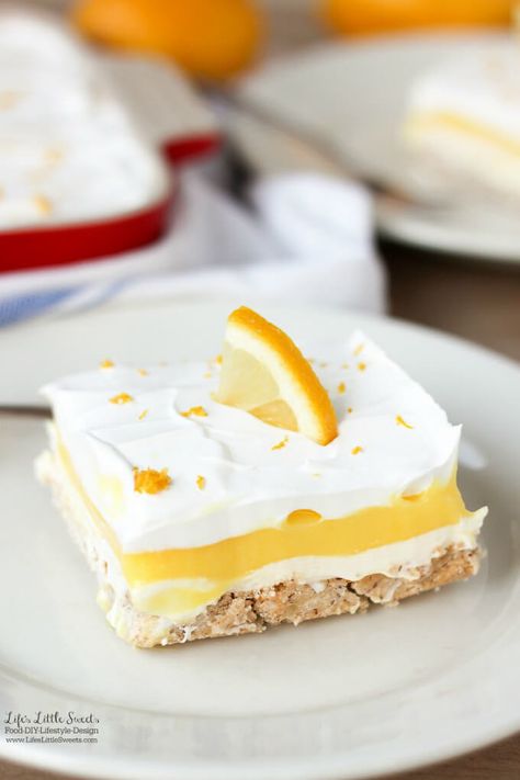 This Dreamy Lemon Lush Dessert Recipe is perfect for Spring and Summer picnics and gatherings. It's so light and refreshing with 4 layers of bottom pecan crust, lemon cream cheese, lemon pudding and topped with a whipped topping garnished with lemon zest. Lemon Lush Recipe, Lemon Lush Dessert, Lemon Desserts Easy, Lush Dessert, Lush Recipes, Valentine Dessert, Lemon Lush, Valentines Recipes Desserts, Potluck Desserts