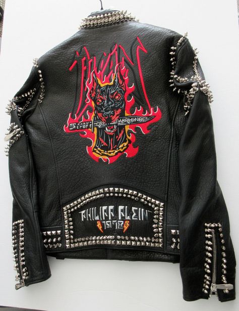 AUTHENTIC  Philip Plein Black Spiked Metal Biker Studded Black Leather Doberman Jacket  Add a dash of rock to your look with this leather perfecto featuring the iconic Doberman made of rhinestones on the back. Zippers on pockets, front and cuffs. Diamond quilted lining  This is a size Large but fits like a Medium. Comes in Original garment zippered bag. Much nicer in person. 100% Authentic. New with tags.     100% AUTHENTIC  GUARANTEED.  Please read my feedback.  I have been selling Authentic Products  for 20 years on Ebay.  My store maintains the highest rating.   UNITED STATES: - USPS First class Item will be shipped the next business day after payment clears. Buyer will be notified of tracking once item is shipped.             International orders: Please note that you may be subject to Rockstar Jacket Men, Biker Fashion Aesthetic, Rockstar Jacket, Spiked Leather Jacket, Punk Leather Jacket, Vest Outfits Men, Punk Fashion Diy, Philip Plein, Gender Fluid Fashion