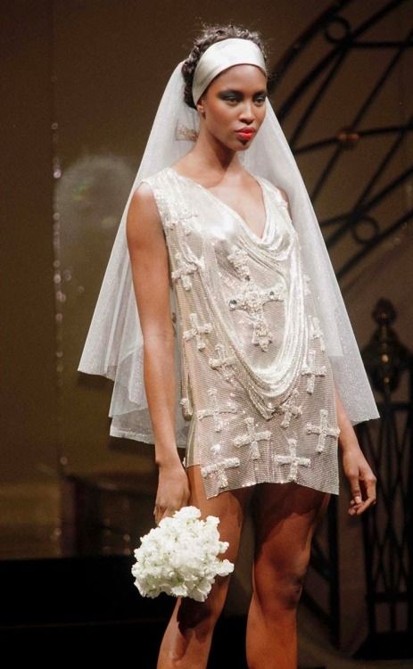 ATELIER VERSACE - 1997, Couture wedding dress; adorned with mini-rhinestone in the shape of crosses, the mesh gown embodies Versace's "vision of fashion that was brash, beautiful, and unapologetic," he wanted women to feel empowered and free (Borrelli-Perrson, 2018). Versace Wedding Dress, Wedding Atelier, Versace Runway, Versace Vintage, Versace Dress, Versace Couture, Vintage Versace, Atelier Versace, Claudia Schiffer