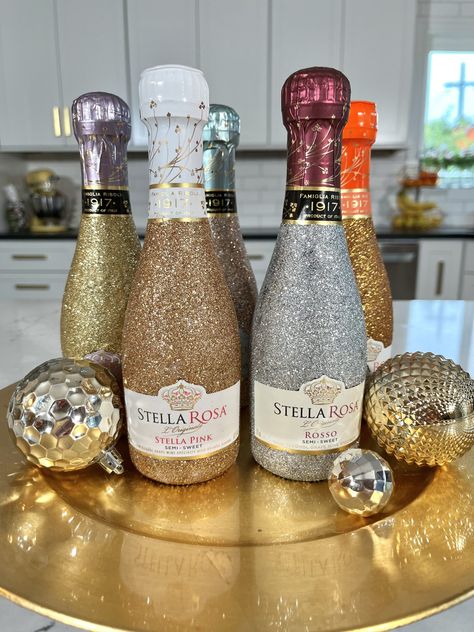 How to Glitter Wine Bottles with Mod Podge - CATHIE FILIAN's Handmade Happy Hour How To Decorate Liquor Bottles, Crafts With Alcohol Bottles, Glitter Cups Diy, Diy Bedazzled Bottle, Bling Bottles Liquor Diy Rhinestone, Decorated Prosecco Bottle, Decorating Champagne Bottles, How To Glitter Alcohol Bottles, Decorated Bottles For 21st