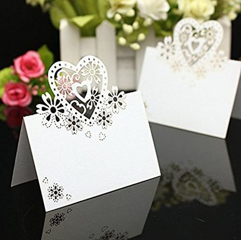 PRICES MAY VARY. paper Hollow heart and flower place card adds a modern touch to any table setting. Put the name of guests in the blank place if you need. Pre scored for easy folding and would look beautiful on any table Beautiful, quality place card Perfect for Wedding Party Decoration Material: Pearlized Cardstock Paper.  Color:White  Size:approx. 4.7*3.5"/12*9cm(L*W)  Package includes: 50 x Place Cards  Warm Tip: Dear buyer, Due to lighting effect,monitor's brightness,manual measurement and e Name Place Cards Wedding, Place Cards Wedding, Fest Temaer, Table Name, Christening Party, Wedding Name Cards, Wedding Party Table, Name Place Cards, Birthday Gift Cards