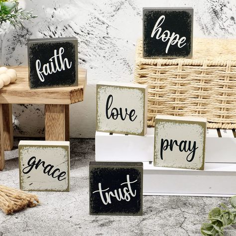 PRICES MAY VARY. Different Words: the package comes with 6 pieces of tabletop block signs, which are printed with [Love, Grace, Pray, Faith, Trust, Hope], can meet your decorate needs and replacement, ideal for your daily home decor Suitable Size: these inspirational blocks for shelves measure approx. 2.5 x 2.5 x 0.6 inches, thickness is 0.6 inch/1.5 cm, suitable for decorating your home on tiered trays and table tops, adding a sense of life Quality and Reliable Material: these inspirational rus Wooden Table Decorations, Signs For Office, Tabletop Bookshelf, Farmhouse Tabletop, Farmhouse Tiered Tray Decor, Hanging Candle Lanterns, Block Signs, Farmhouse Tiered Tray, Christmas Craft Fair